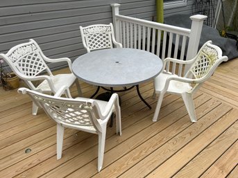 44 Inch Metal Outdoor Table With 4 Heavy Plastic Chairs And Cushions. Chairs Need To Be  Power Washe The Table