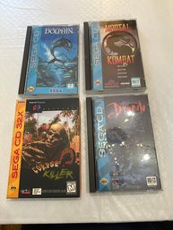 Lot Of Four Sega CD Games Ecoo The Dolphin, Corpse Killer, Dracula, And Mortal Kombat All In Excellent Cond