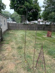 Two 5 Ft Metal Plant Holders And One 43 Inch By 16 Inch Ornate Metal Vine Stand In Nice Condition