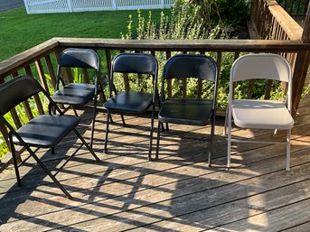 Lot Of 5 Metal Folding Chairs 4 Black 1 Tan 3 Black Have Padded Seats