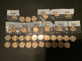 Large Lot Of 34 Uncirculated Presidential One Dollar US COINS
