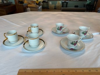 Two Small Demitasse Sets Each Is A Set Of 3 Cups And Sauce.