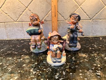 2 Vintage Eric Stauffer Figurines And 1 Hummel Figurine