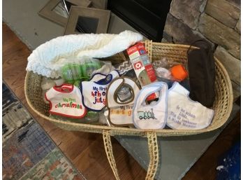 Bassinet Basket Filled With Baby Stuff Bottles Bibs Blanket And More