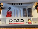 Ridgid Drum Sander With Some Sand Paper On Work Table