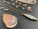 Large Assortment Of Costume Jewelry In Pinks, Greens, And Browns