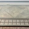 Glass Top Metal Coffee Table With Slate Tile Accent