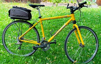 Yellow Cannondale Silk Path 700 Hybrid Bike With Aluminum Frame And Pannier Bag