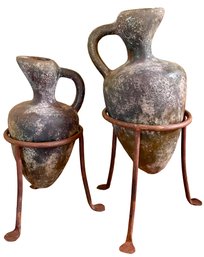 2 Clay Pitchers On Metal Stands