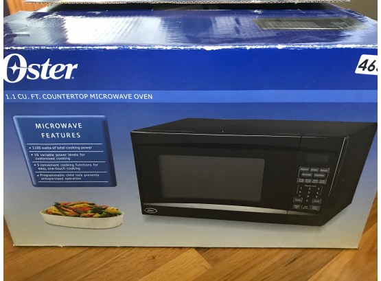 Oster 1.1 Cubic Fot Counter Top Microwave Oven In Box