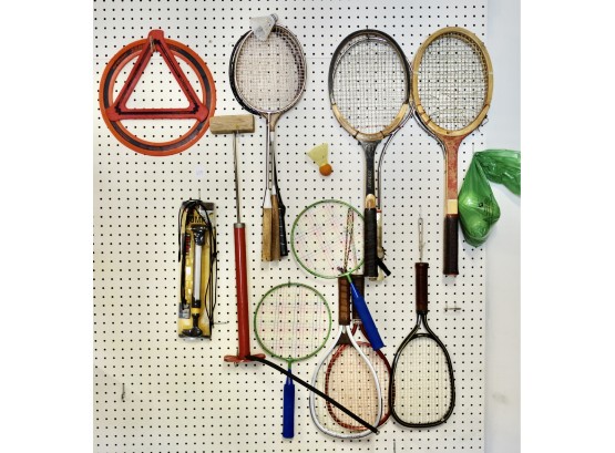 Pegboard Full Of Rackets, Bike Pumps, Balls, & More