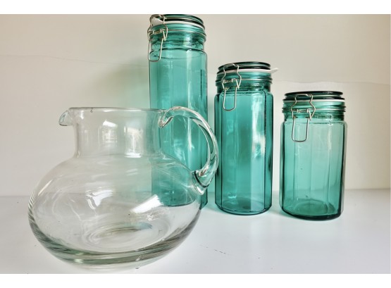 3 Aqua Canisters And A Large Glass Pitcher