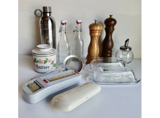 Assorted Kitchen Supplies Including Bottles, Crumb Brushes, Butter Dishes, & More