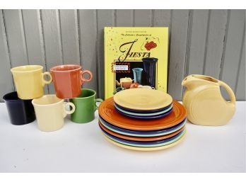 Fiesta Mugs, Pitcher, And Unmarked Plates With Collector's Book