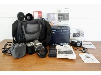 2 Panasonic Lumix Digital Cameras With Accessories And Boxes, One Is An SLR