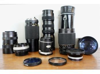 Large Assortment Of Camera Lenses, 2 Cases, & More