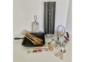 Vintage Kitchen Including Castiron Skillett, Bread Form And Wooden Handle Cookie Cutters, And More