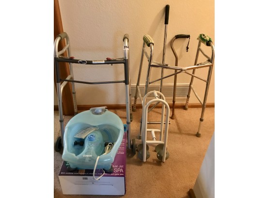 Home Health Supplies Including 2 Walkers, A Cane, Bathtub Assist, & Foot Spa