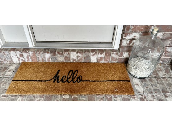 Hello Door Mat And Large Glass Jug With Pebbles