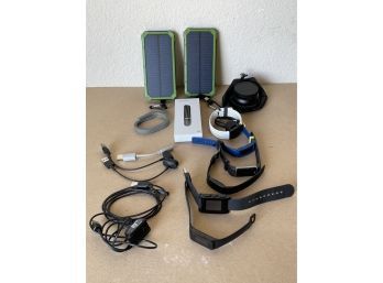 Odds & Ends Including 2 Solar Chargers, Various Fitbits, And Wide Angle Lenses