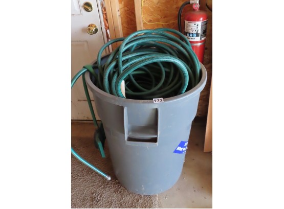 Large Trash Can Full Of Hoses