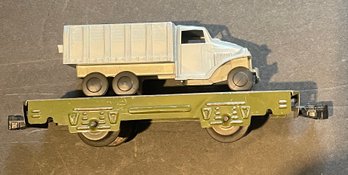 MARX OLIVE FLAT CAR WITH TRUCK CARGO - WE CAN SHIP!