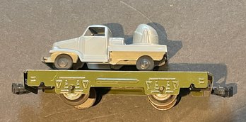 MARX OLIVE MILITARY FLAT CAR WITH VEHICLE AS SHOWN - WE CAN SHIP!