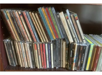 SHELF OF ASSORTED CDS