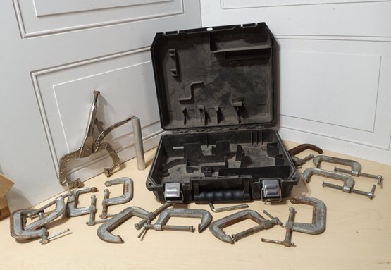 A  DeWalt Brand Plastic Case And Several Hand-powered C-clamps