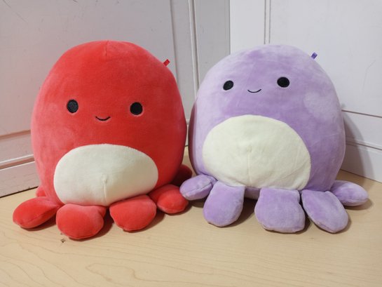2 'Squishmallows' Dolls. One Red, One Purple.