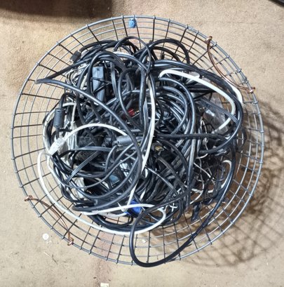 An 18' Diameter X 14 1/2' Tall Metal Basket Full Of An Assortment Of Cables