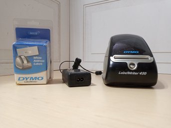 A Dymo Brand LabelWriter 450 And A Package Of Labels.