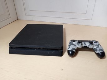 PS4 System And A Controller