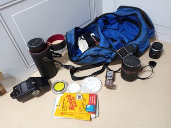 Camera Bag With An Assortment Of Lenses And More. See Pictures