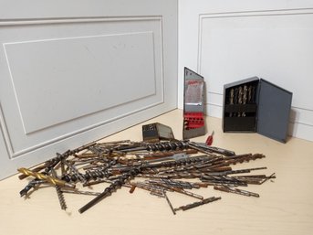 An Assortment Of Drill Bits And 3 Different Drill Caddies