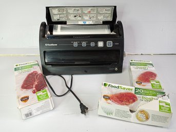 A FoodSaver Vacuum &Seal Machine With Some Replacement Bags
