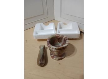 A Stone Mortar And Pestal Set. Includes Original Packaging.