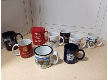 8 Mugs. See Pictures For Contents Of The Lot. One Has A Lid.