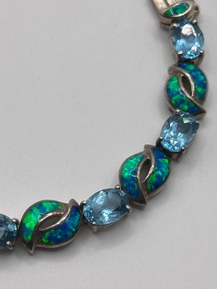 Sterling Bracelet With Blue Fire And Light Blue Gems   18.88g    7.5'