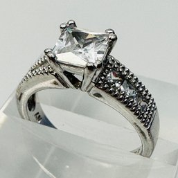 NV-sterling Silver Engagement Style Ring W/ Large Clear Stone W/ Clear Stones On Band Size 8. 5.06 G.