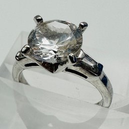 Sterling Silver Engagement Style Ring With Large Clear Stone And Clear Stones On Band Size 6.5. 3.73 G.