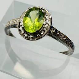 Sterling Silver Engagement Style Ring With Green Colored Stone In Clear Stone Setting Size 9. 1.79 G.
