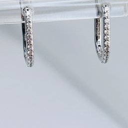 Sterling Silver Clear Stone U Shaped Earrings. 1.00 G.