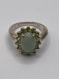 China-  Sterling Ring With Light Green Stone And Small Light Green Gems 4.2 6g.  Sz. 7
