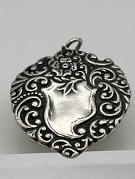 T Foree Sterling Repousse Floral Pendant