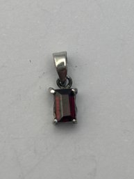 Sterling Silver Pendant With Rectangular Ruby Colored Stone .33 G