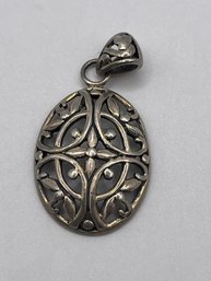 Sterling Oval Pendant With Metal Flower Design  3.0g