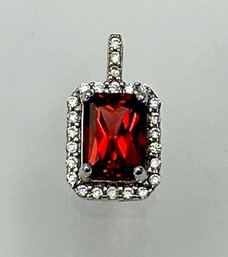 Red Rhinestone Solitaire Pendant Set In Sterling And Surrounded By Clear Stones 1.03g