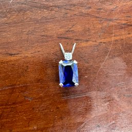 10K White Gold Pendant With Emerald Cut Simulated Sapphire & CZ - 0.41 Grams