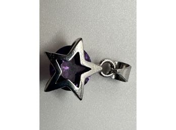 Sterling Silver Pendant With Purple Colored Stone And Star Surround 1.42 G.